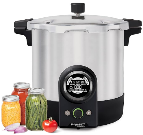 Large 23-quart pressure canner on stovetop with metal rack inside